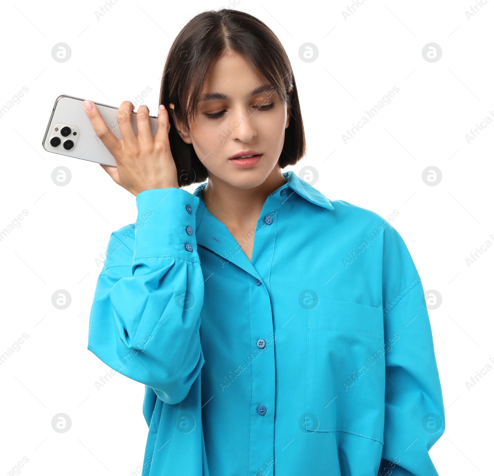 Photo of Beautiful woman with smartphone listening to voice message on white background