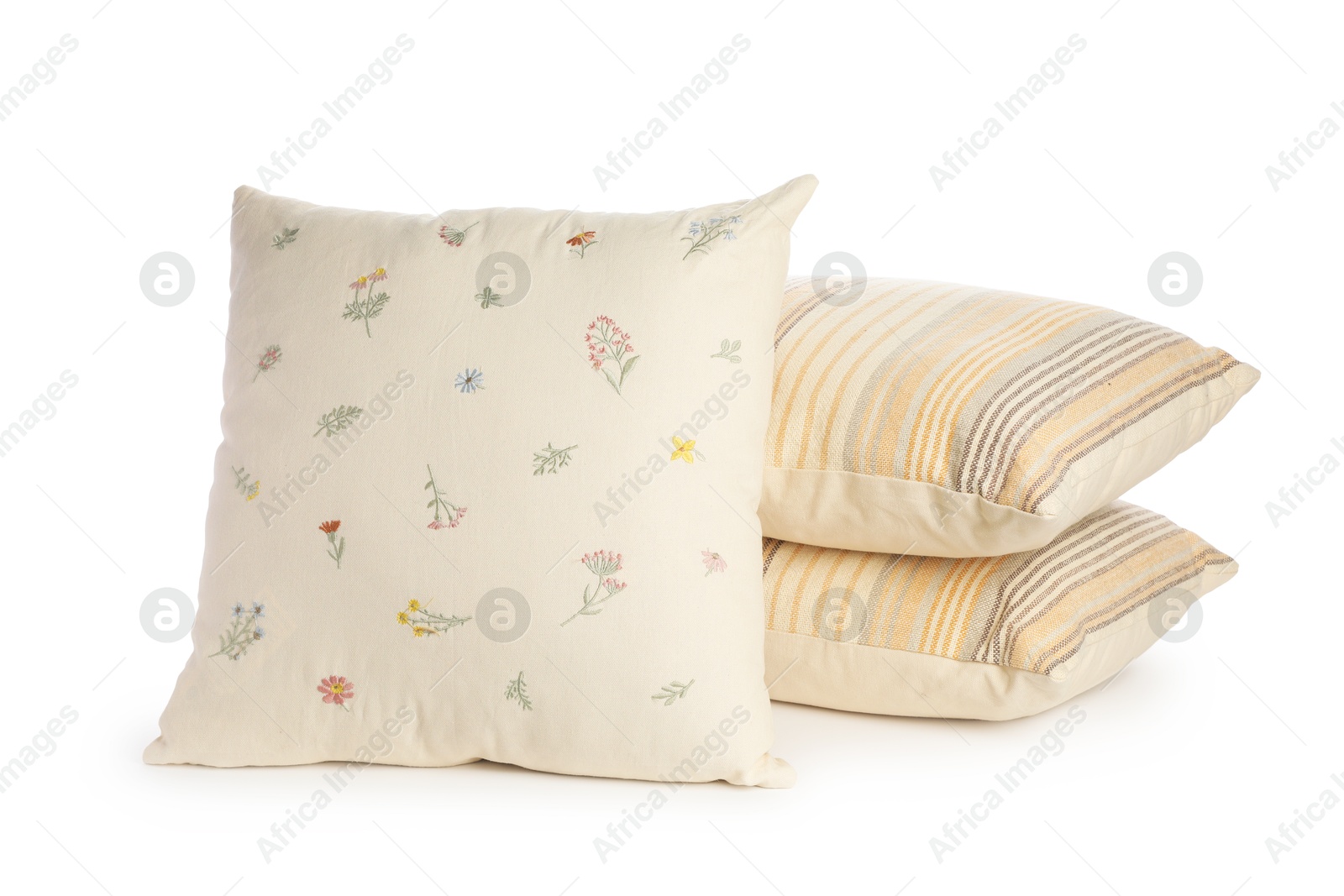 Photo of Three different color pillows isolated on white