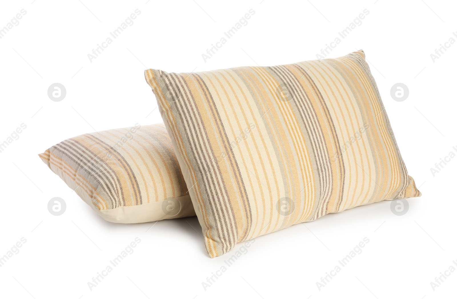 Photo of Two light striped pillows isolated on white