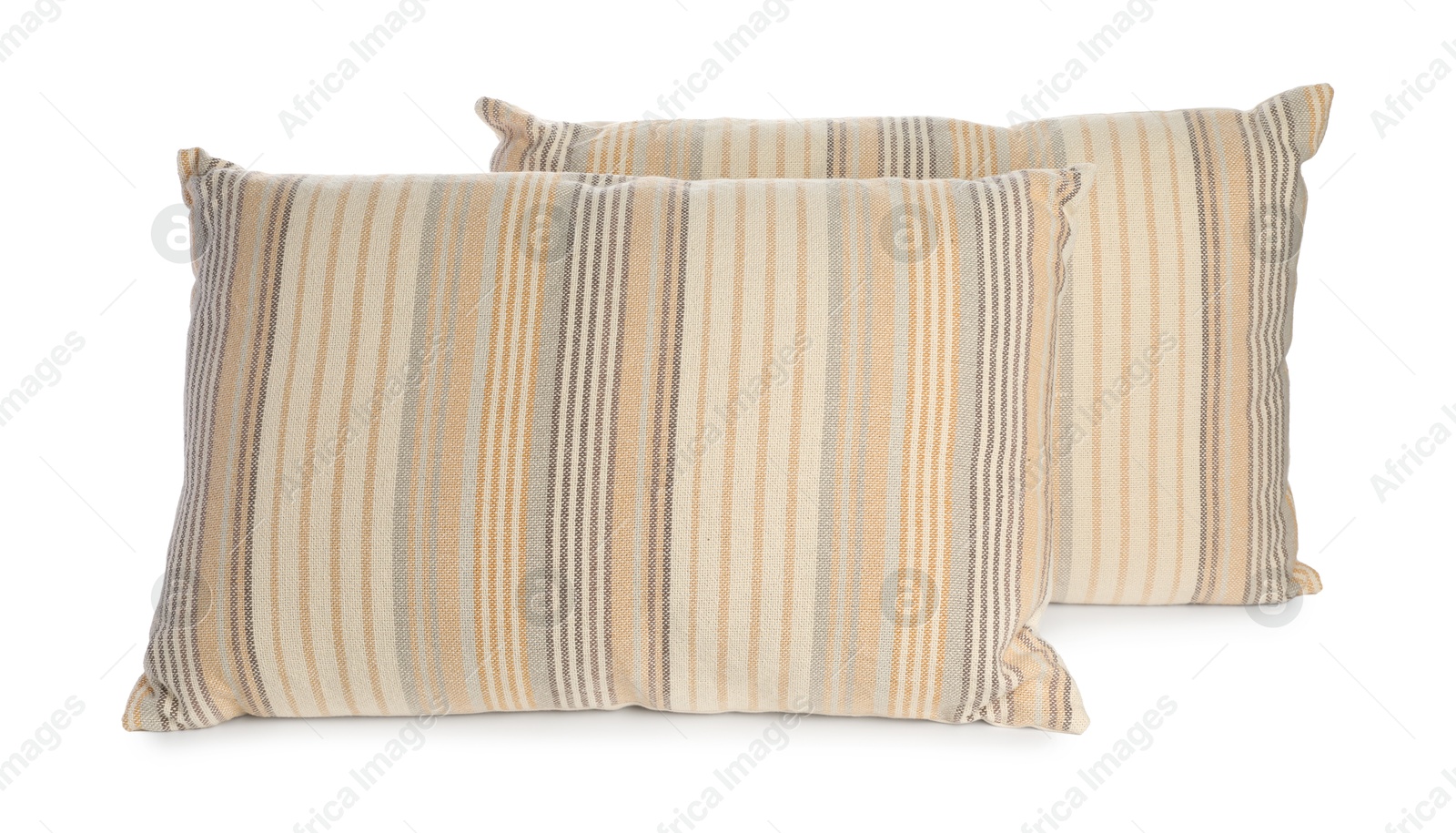 Photo of Two light striped pillows isolated on white