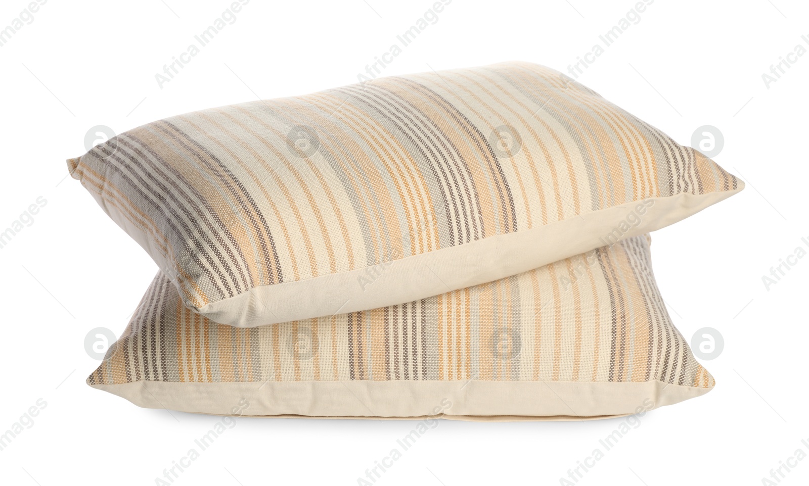 Photo of Two light striped pillows isolated on white