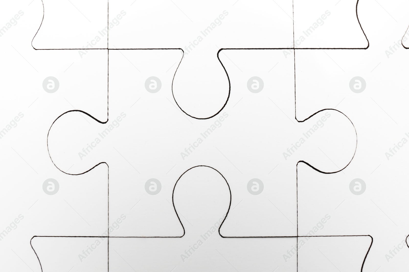 Photo of White puzzle as background, top view. Intellectual game