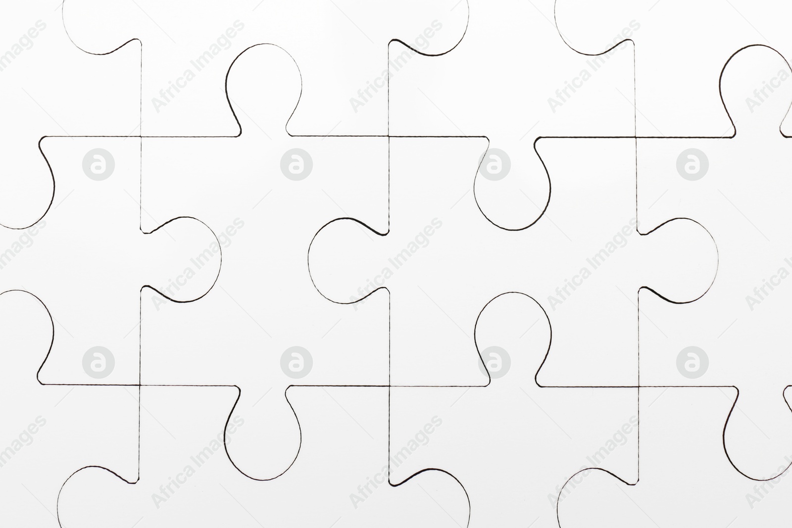 Photo of White puzzle as background, top view. Intellectual game