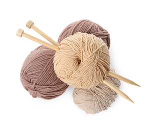 Photo of Skeins of soft yarn and knitting needles isolated on white, top view