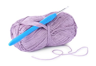 Photo of Skein of violet yarn and crochet hook isolated on white