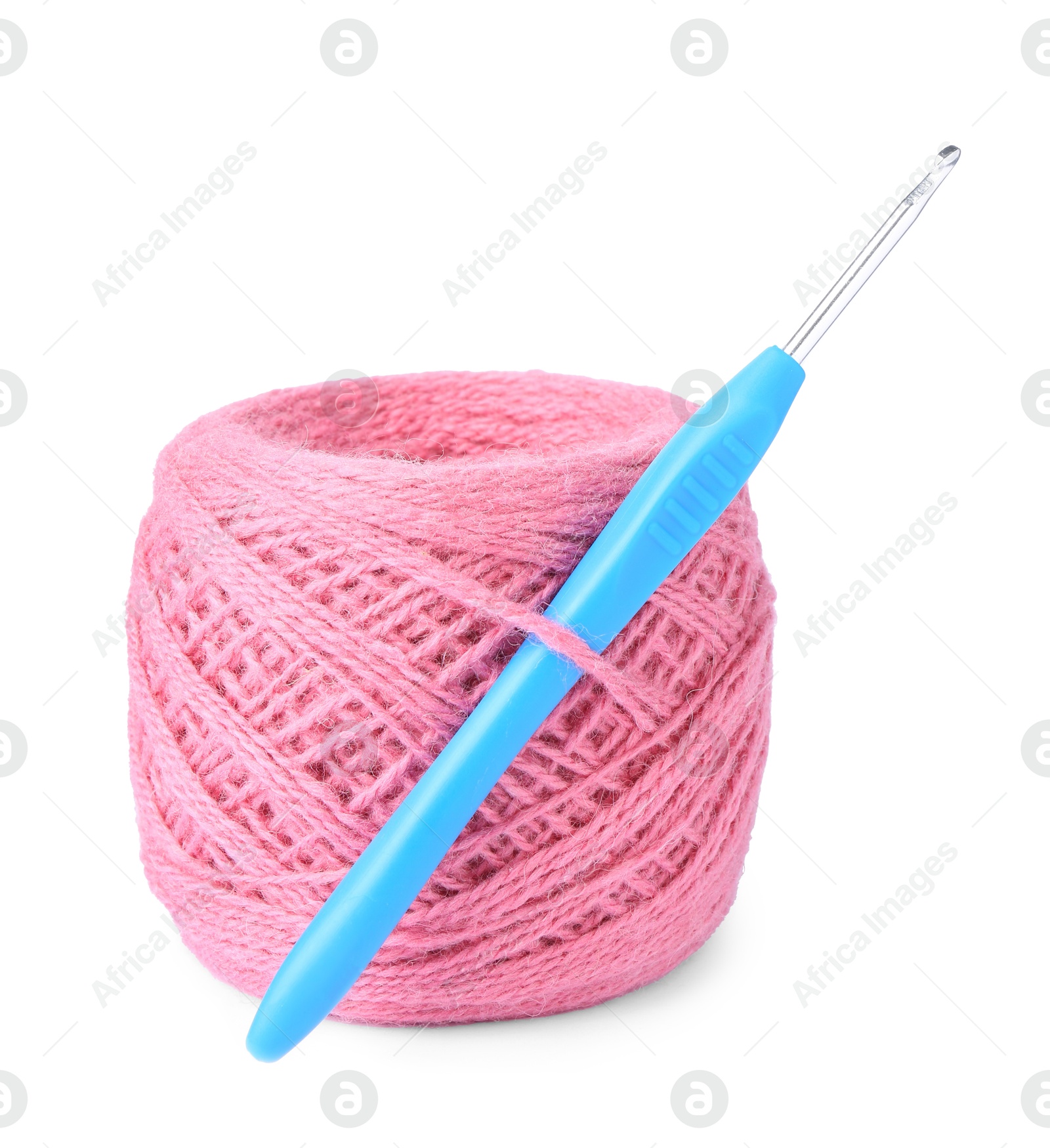 Photo of Thread of pink yarn and crochet hook isolated on white