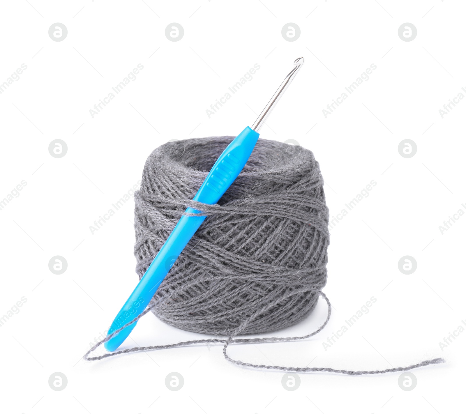 Photo of Thread of gray yarn and crochet hook isolated on white