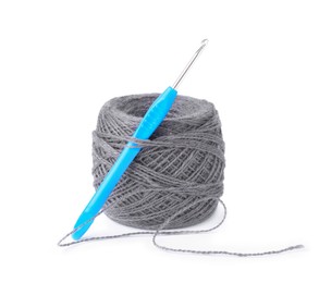 Photo of Thread of gray yarn and crochet hook isolated on white