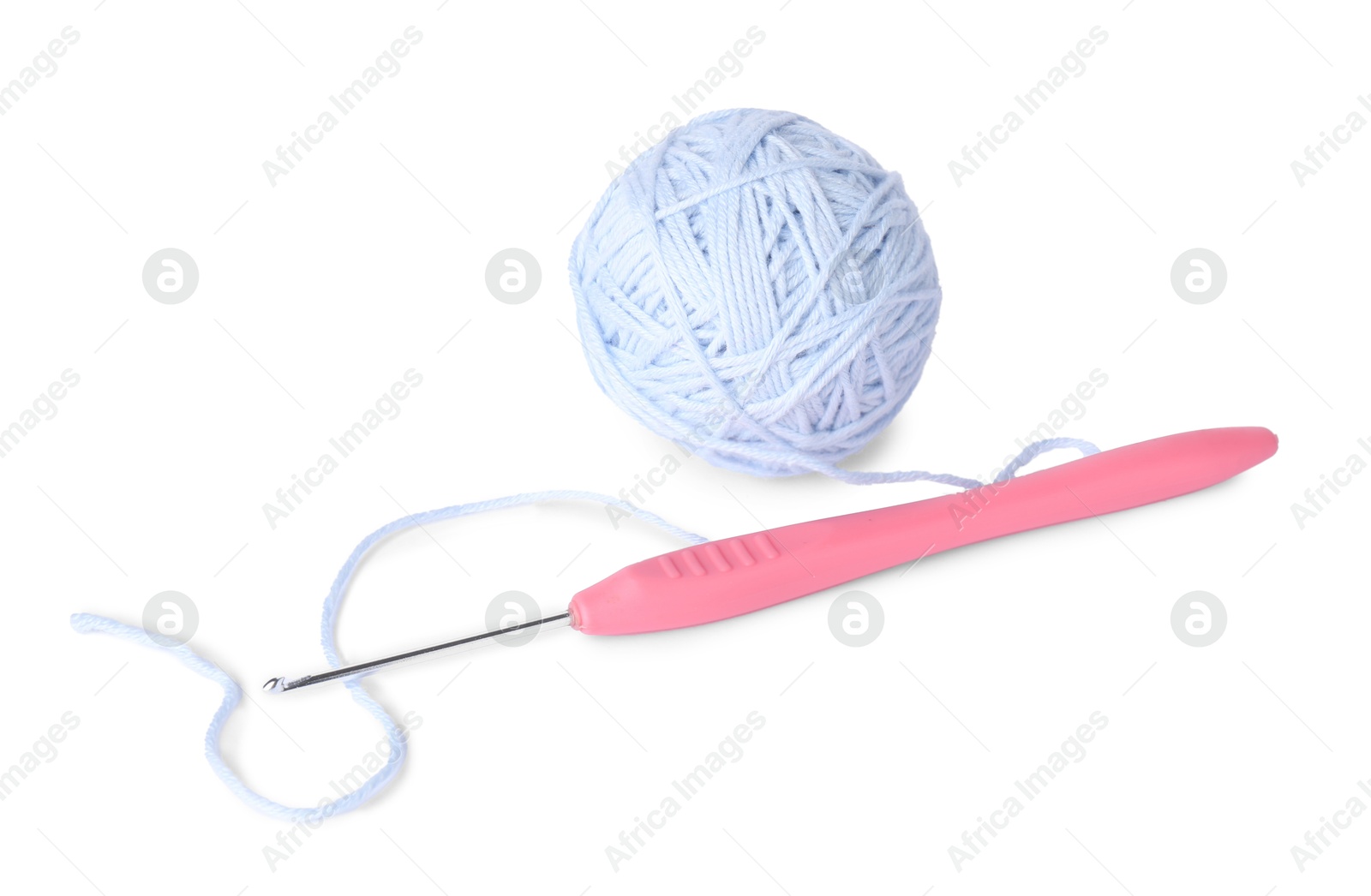 Photo of Ball of soft yarn and crochet hook isolated on white