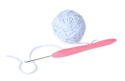 Photo of Ball of soft yarn and crochet hook isolated on white