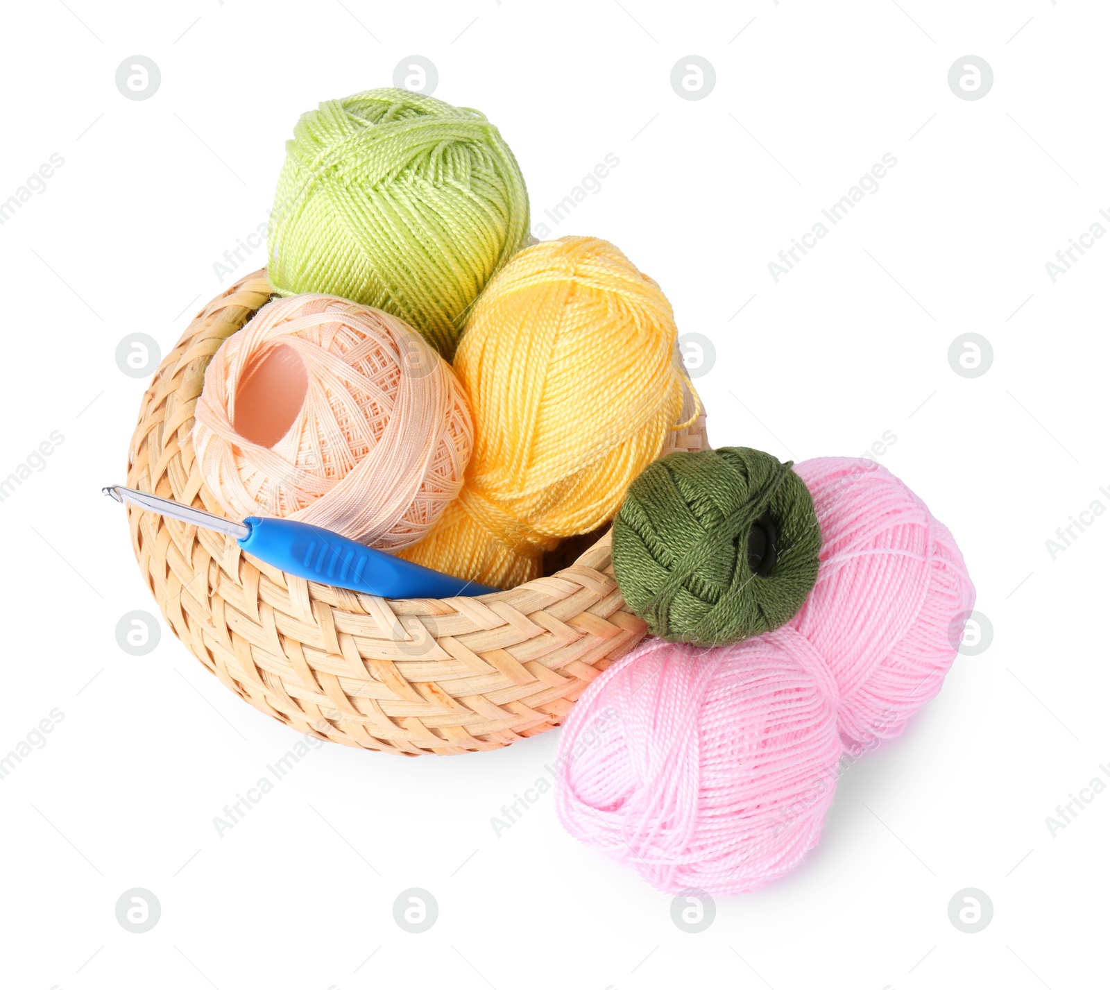 Photo of Colorful yarns and crochet hook in wicker basket isolated on white