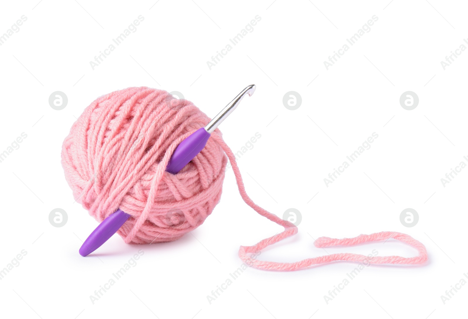 Photo of Pink ball of yarn and crochet hook isolated on white