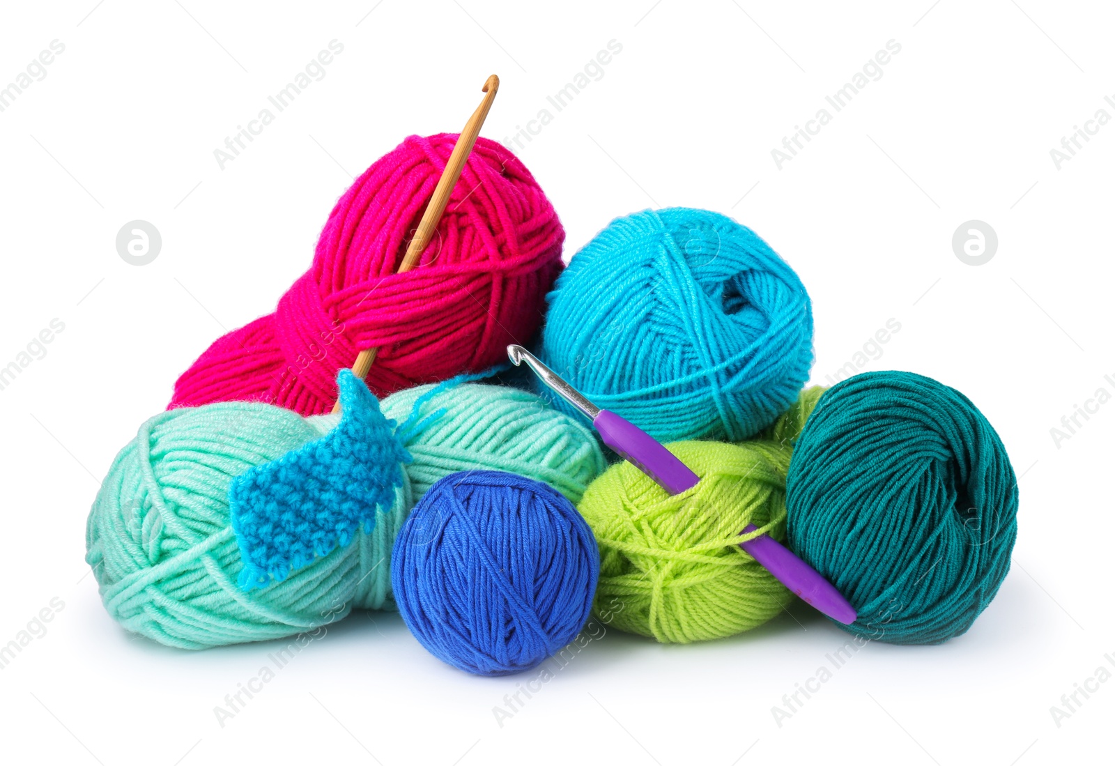 Photo of Different yarns, pattern sample and crochet hooks isolated on white