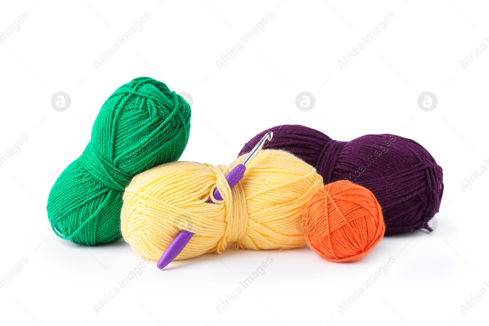 Photo of Different yarns and crochet hook isolated on white