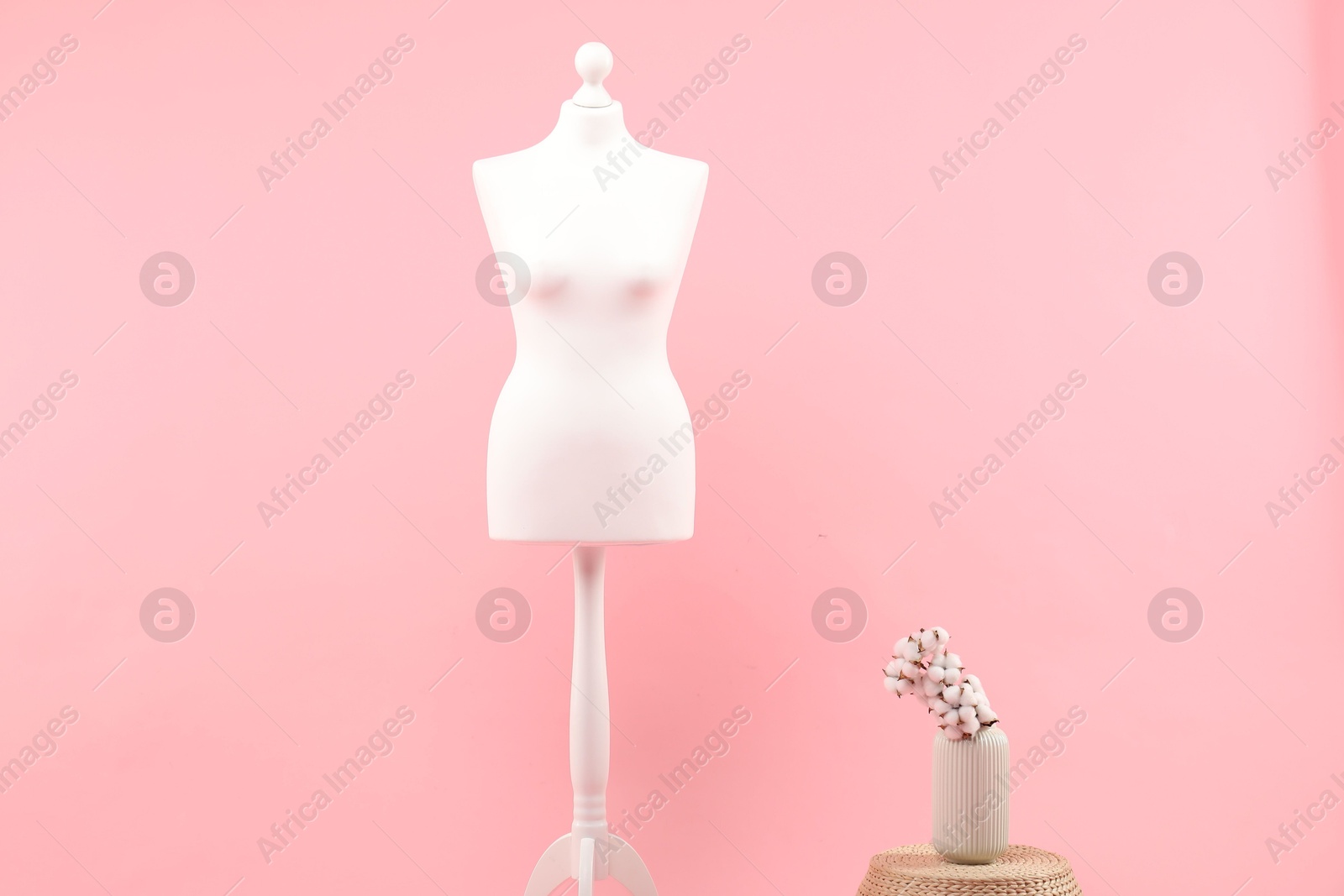 Photo of Mannequin and stylish vase on pink background