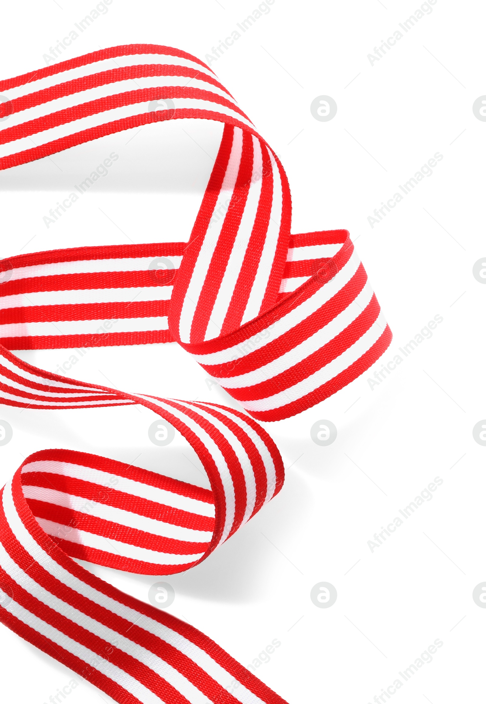 Photo of One striped ribbon isolated on white, top view