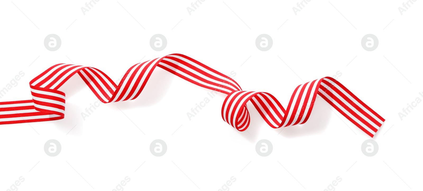 Photo of One striped ribbon isolated on white, top view