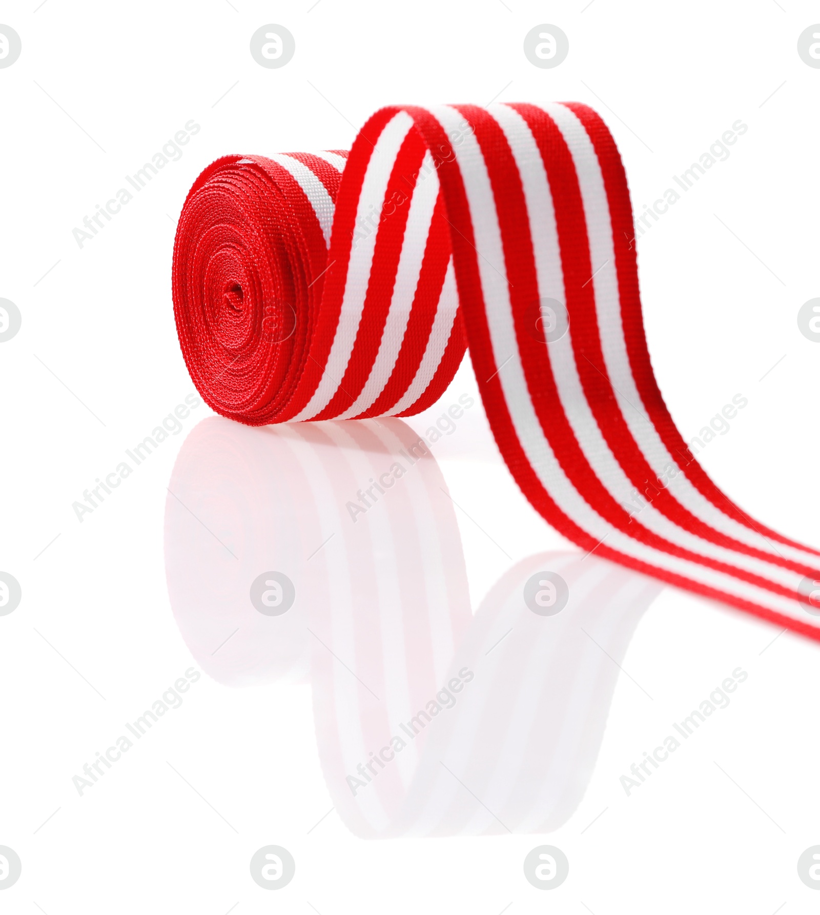 Photo of Roll of striped ribbon isolated on white