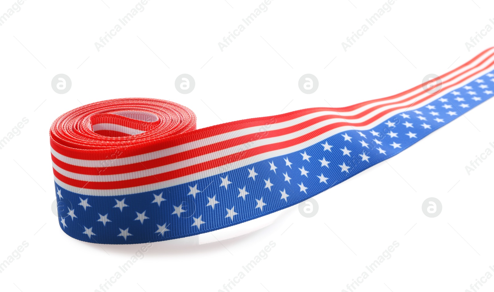 Photo of Roll with ribbon in colors of American flag isolated on white