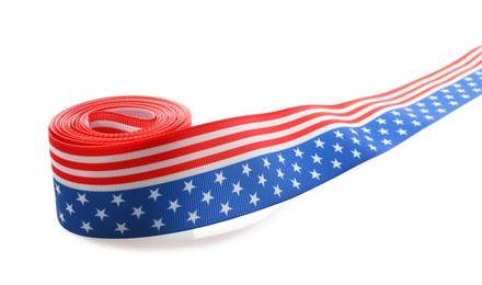 Photo of Roll with ribbon in colors of American flag isolated on white