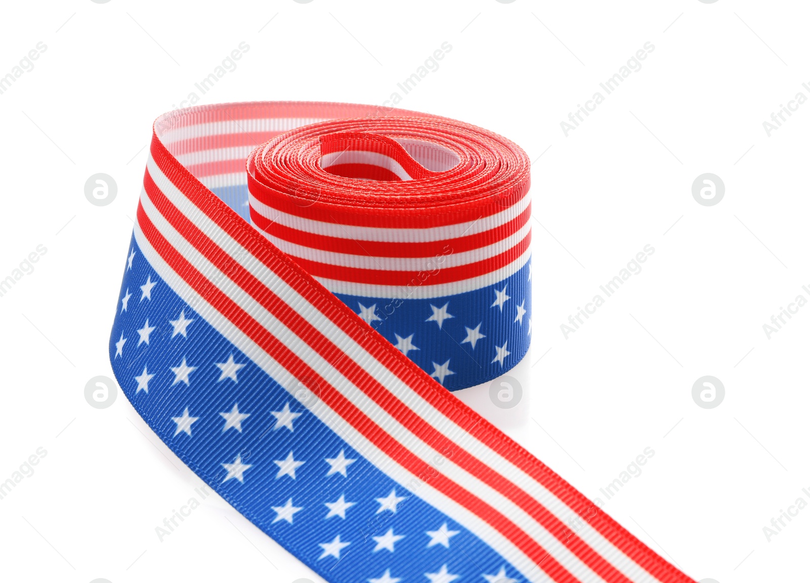 Photo of Roll with ribbon in colors of American flag isolated on white