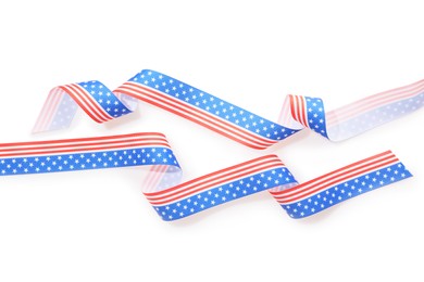 Ribbons in colors of American flag on white background, top view