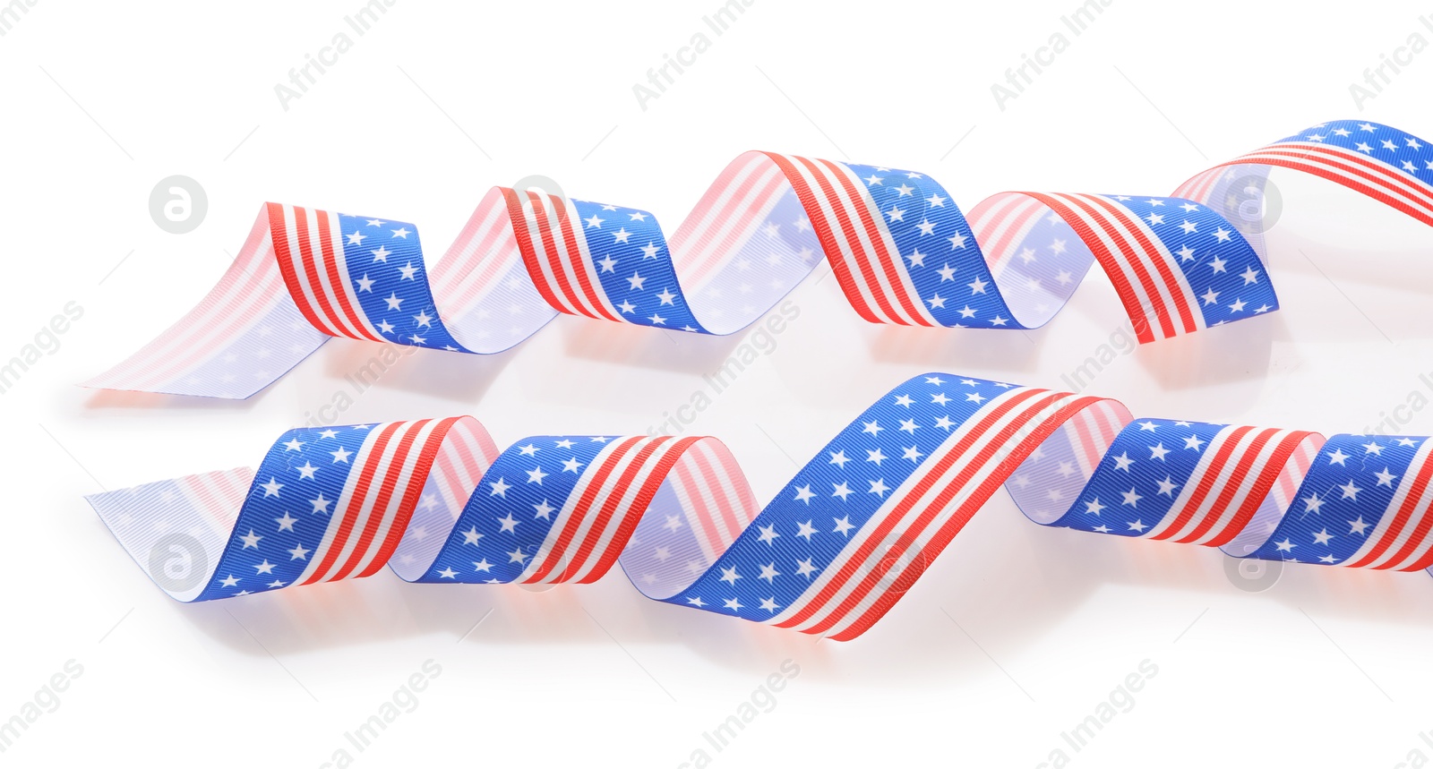 Photo of Ribbons in colors of American flag on white background\