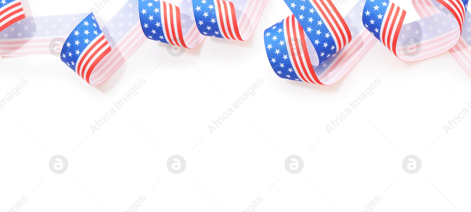 Photo of Ribbon in colors of American flag isolated on white, top view