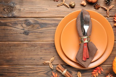 Photo of Stylish place setting and autumn decor on wooden table. Space for text