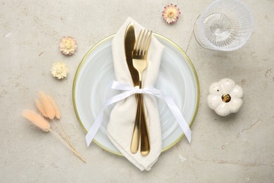 Photo of Stylish place setting with autumnal decor on grey textured table