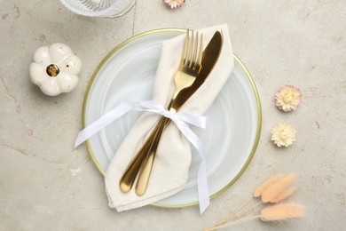 Photo of Stylish place setting with autumnal decor on grey textured table