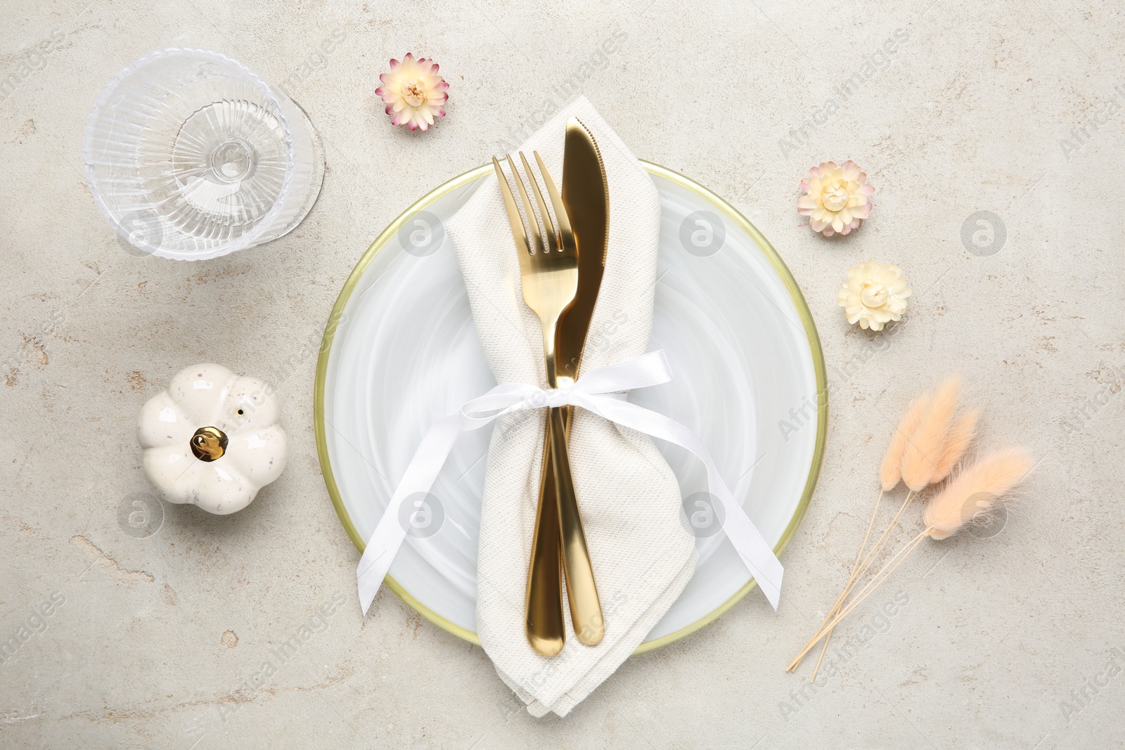 Photo of Stylish place setting with autumnal decor on grey textured table