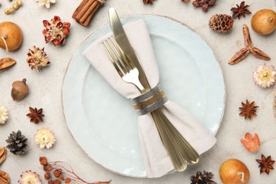 Photo of Stylish place setting and autumn decor on grey textured table