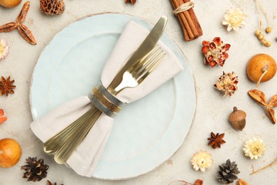 Photo of Stylish place setting and autumn decor on grey textured table