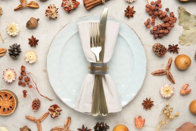 Stylish place setting and autumn decor on grey textured table