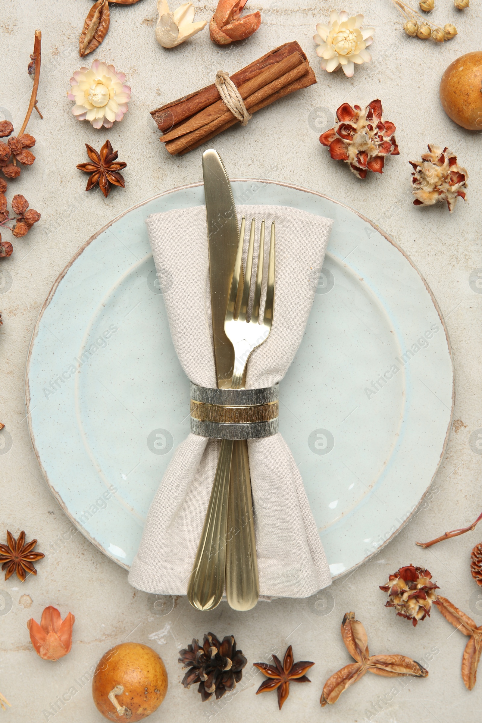 Photo of Stylish place setting and autumn decor on grey textured table