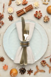 Stylish place setting and autumn decor on grey textured table