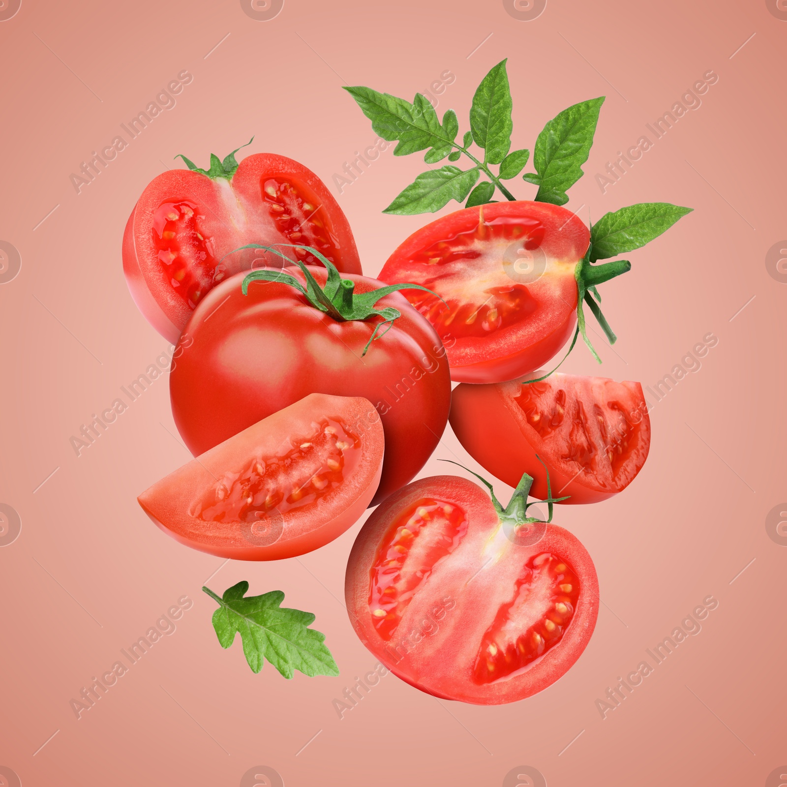 Image of Fresh tomatoes with green leaves in air on pale red background