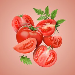 Image of Fresh tomatoes with green leaves in air on pale red background