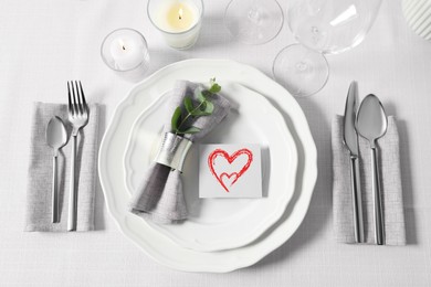 Image of Table setting for romantic Valentine's day celebration, top view