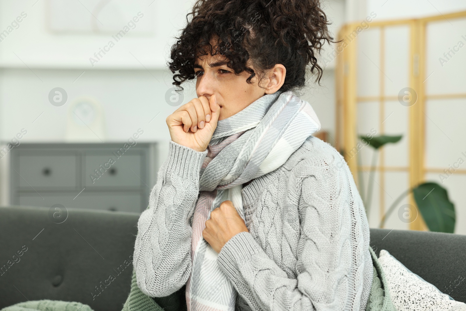 Photo of Cold symptom. Young woman suffering from illness at home