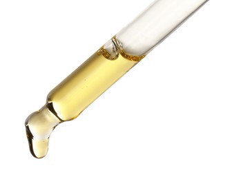 Photo of Essential oil dripping from pipette against white background