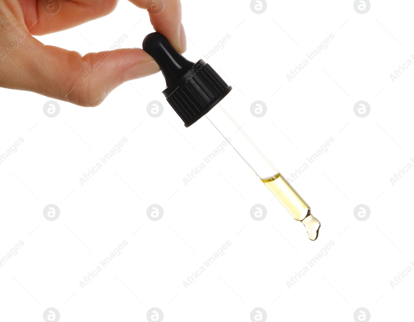 Photo of Essential oil dripping from pipette against white background