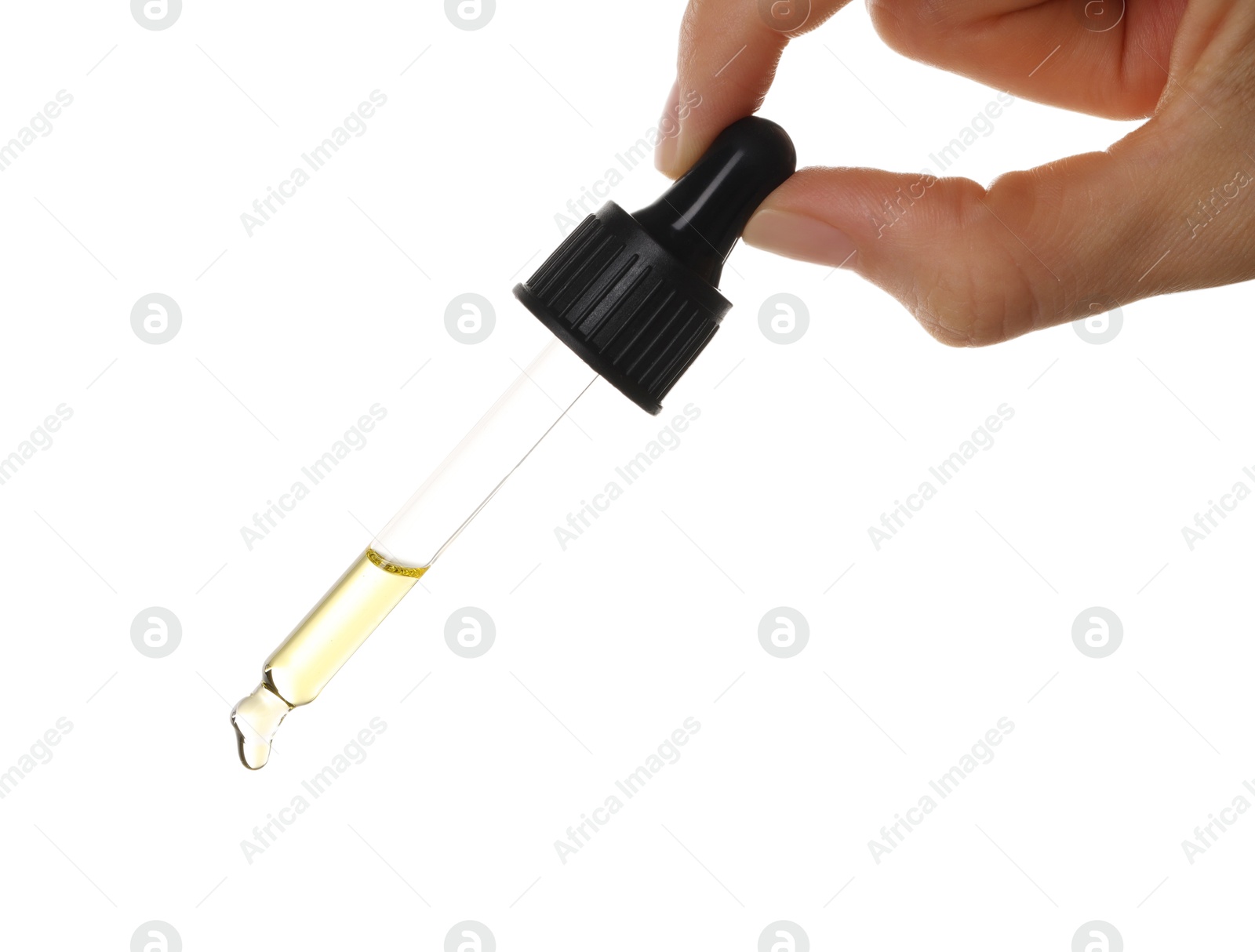 Photo of Essential oil dripping from pipette against white background