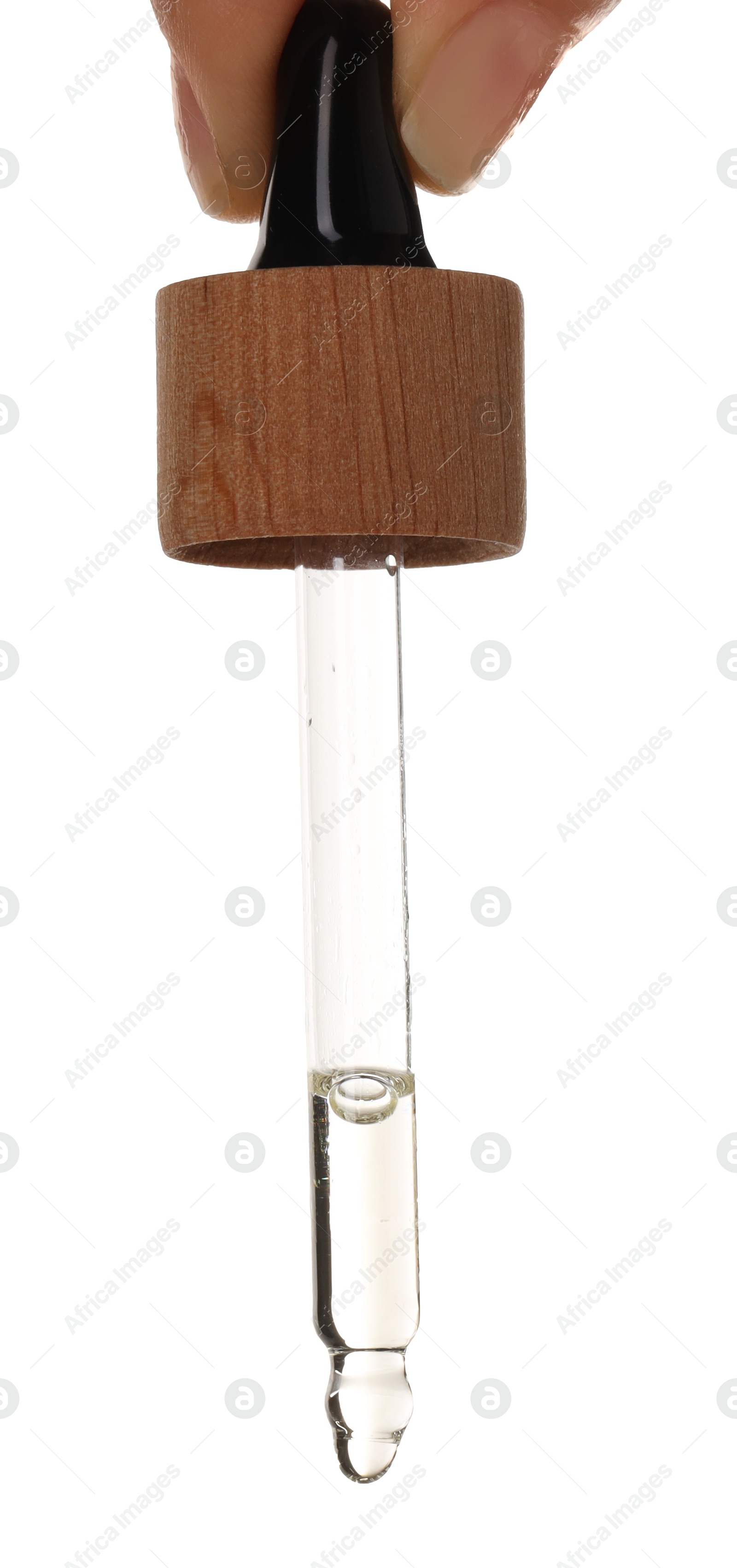 Photo of Essential oil dripping from pipette against white background