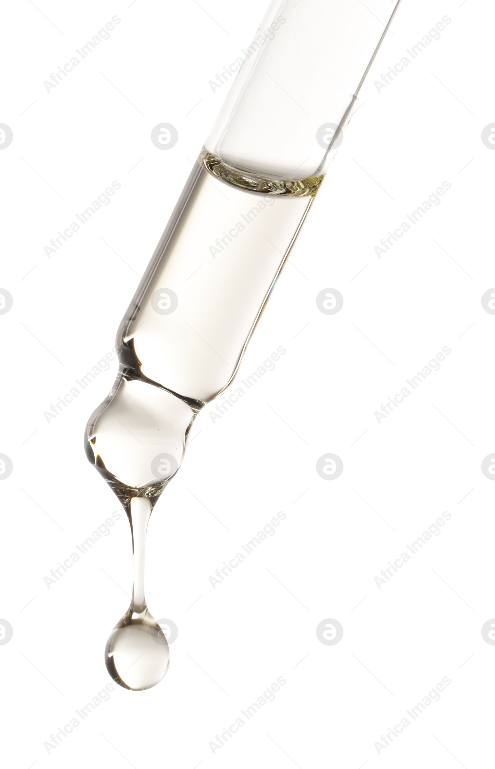 Photo of Essential oil dripping from pipette against white background