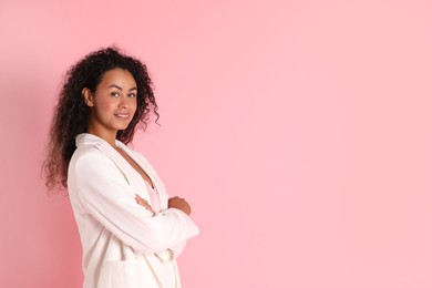 Photo of Beautiful woman in stylish jacket on pink background, space for text