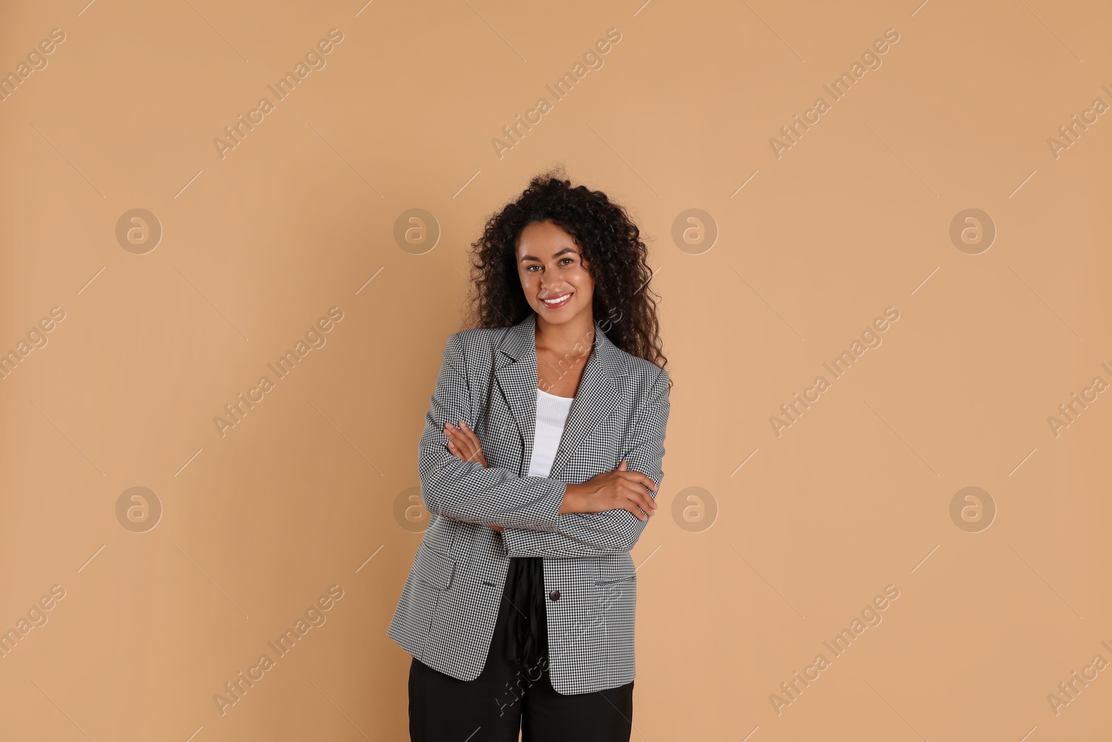 Photo of Beautiful woman in stylish jacket on beige background