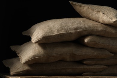 Photo of Group of burlap sacks on wooden table