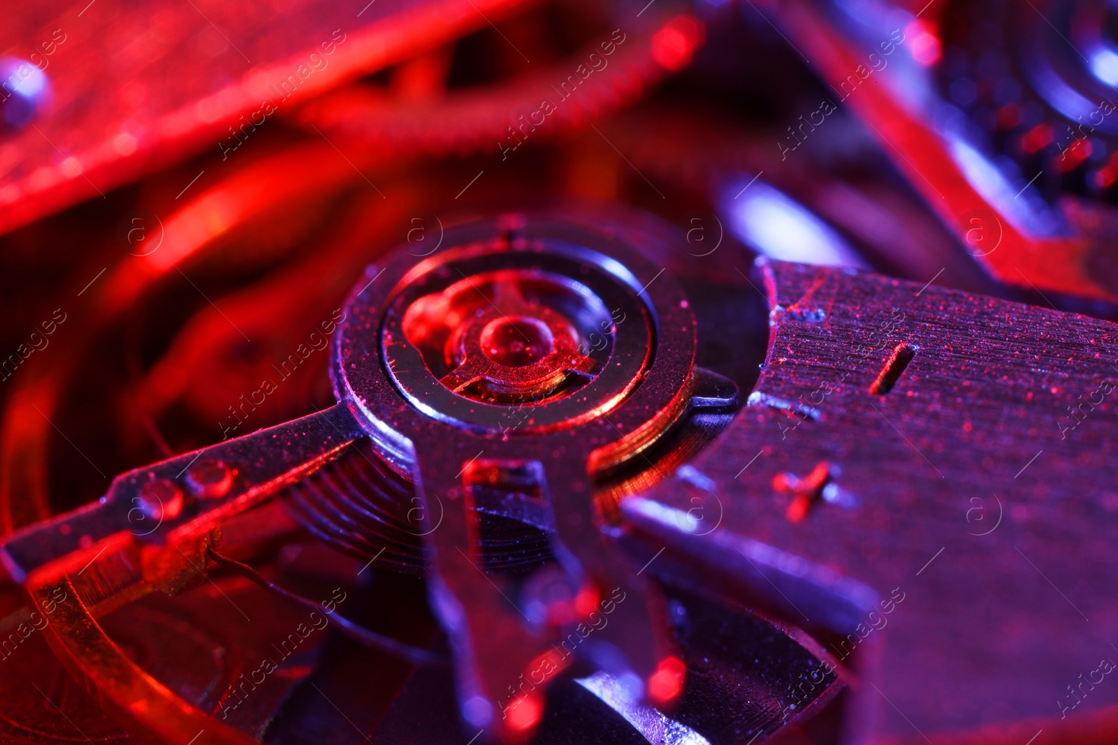 Photo of Mechanism of vintage wrist watch as background, closeup. Color toned